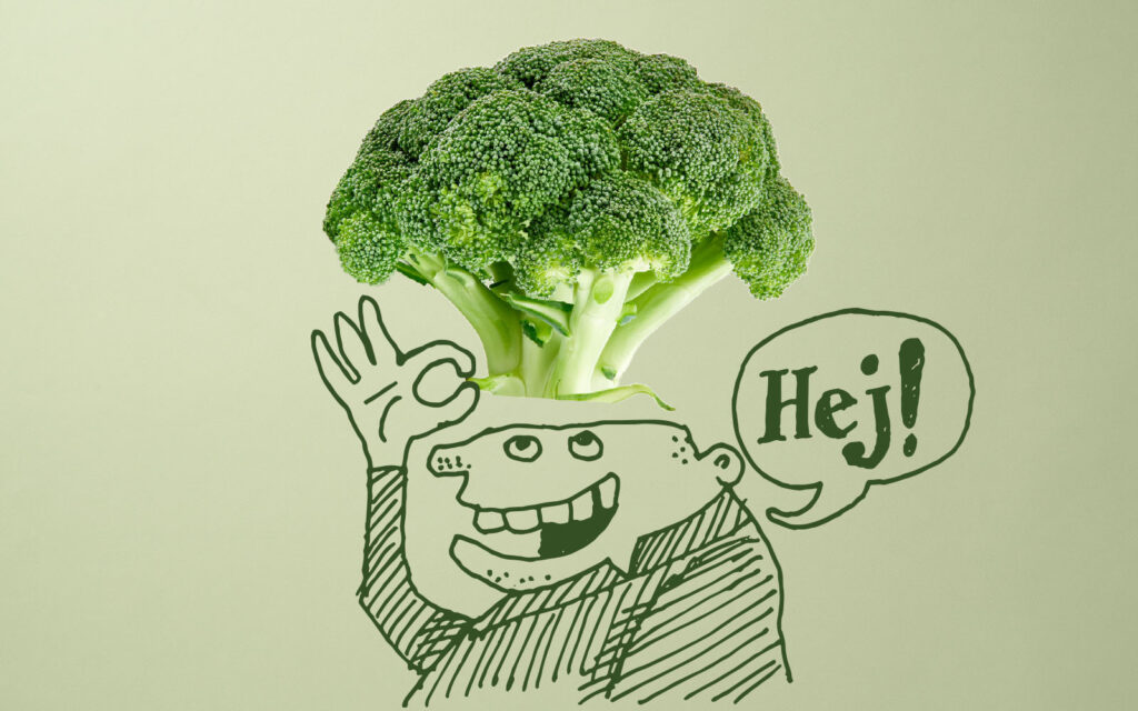 Tecknad figur som lyfter på en hatt gjord av en broccolikvist, samtidigt som han säger hej.